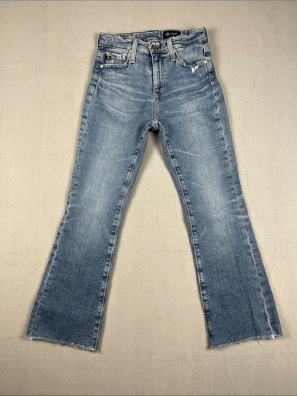 AG Adriano Goldschmmied Light Blue Farrah Boot Crop with raw hem
Size: 25